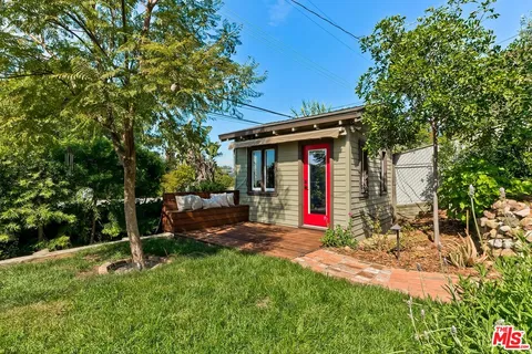 a view of a balcony with chairs