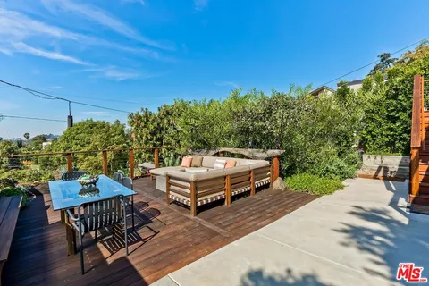 an aerial view of a house with a garden