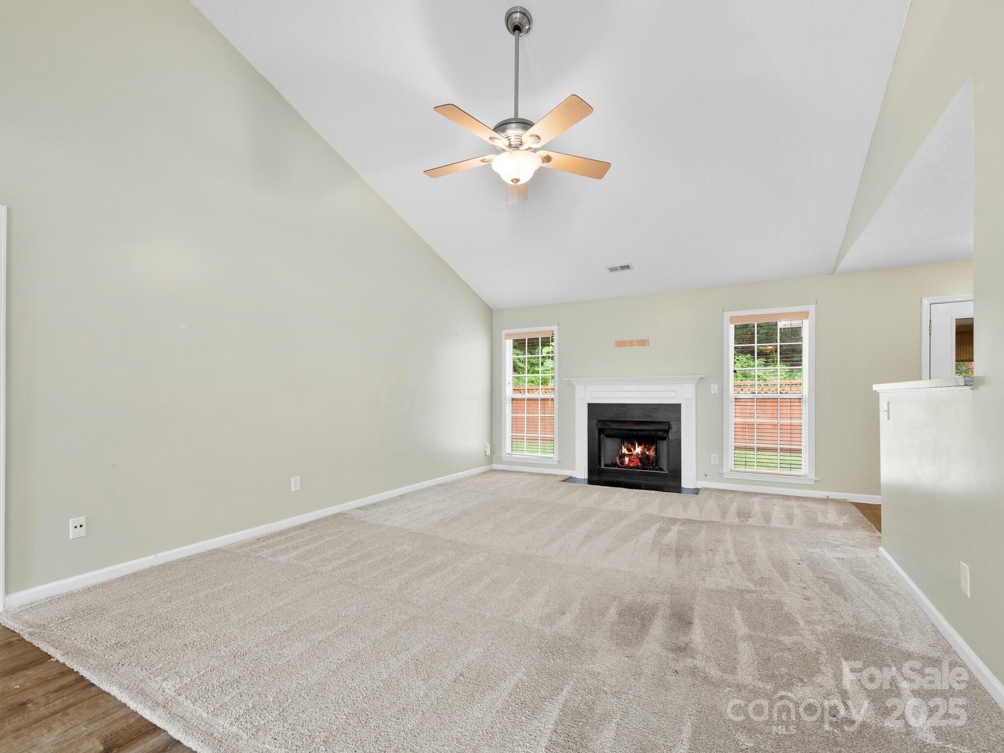 42 Morning Mist Road Fletcher, NC 28732 - Photo 3 of 25 a view of a livingroom with a fireplace a ceiling fan and a fireplace