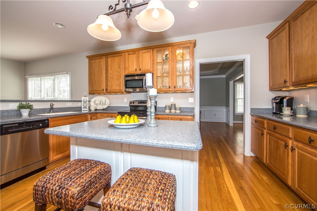 1000 Cohen Trail Midlothian, VA 23114 - Photo 12 of 41 a kitchen with stainless steel appliances granite countertop a sink a stove cabinets counter space and a window