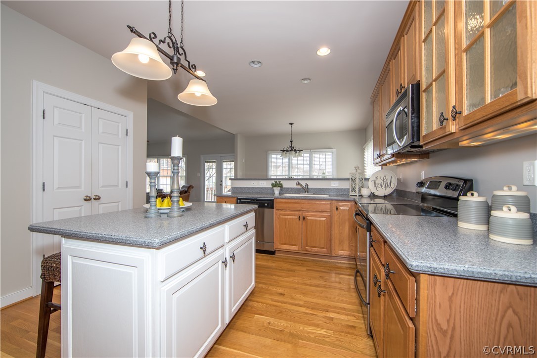1000 Cohen Trail Midlothian, VA 23114 - Photo 13 of 41 a kitchen with stainless steel appliances granite countertop a sink a stove and a wooden floors