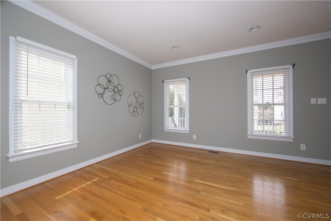 1000 Cohen Trail Midlothian, VA 23114 - Photo 17 of 41 a view of an empty room with wooden floor and a window