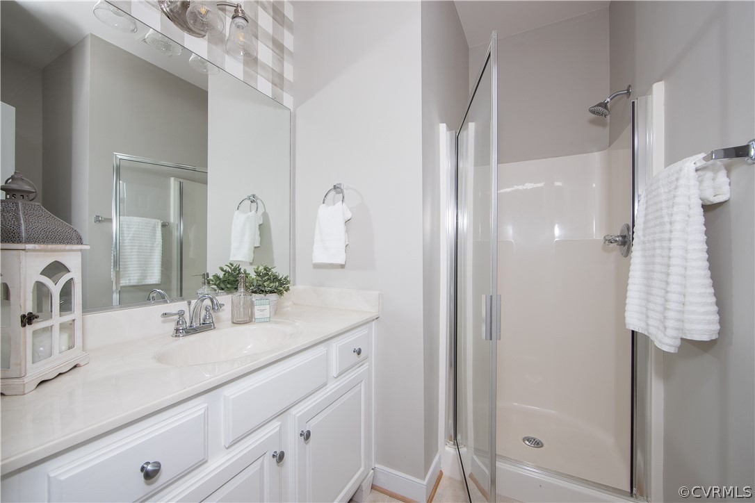1000 Cohen Trail Midlothian, VA 23114 - Photo 20 of 41 a bathroom with a sink double vanity and shower