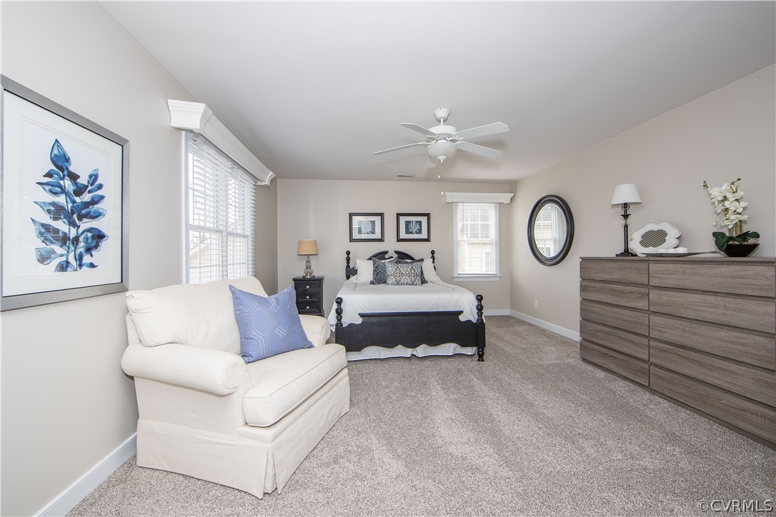 1000 Cohen Trail Midlothian, VA 23114 - Photo 26 of 41 a spacious bedroom with a bed and a chandelier