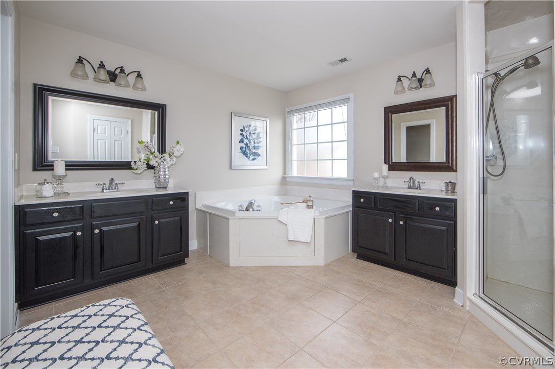 1000 Cohen Trail Midlothian, VA 23114 - Photo 28 of 41 a spacious bathroom with a granite countertop tub sink and mirror