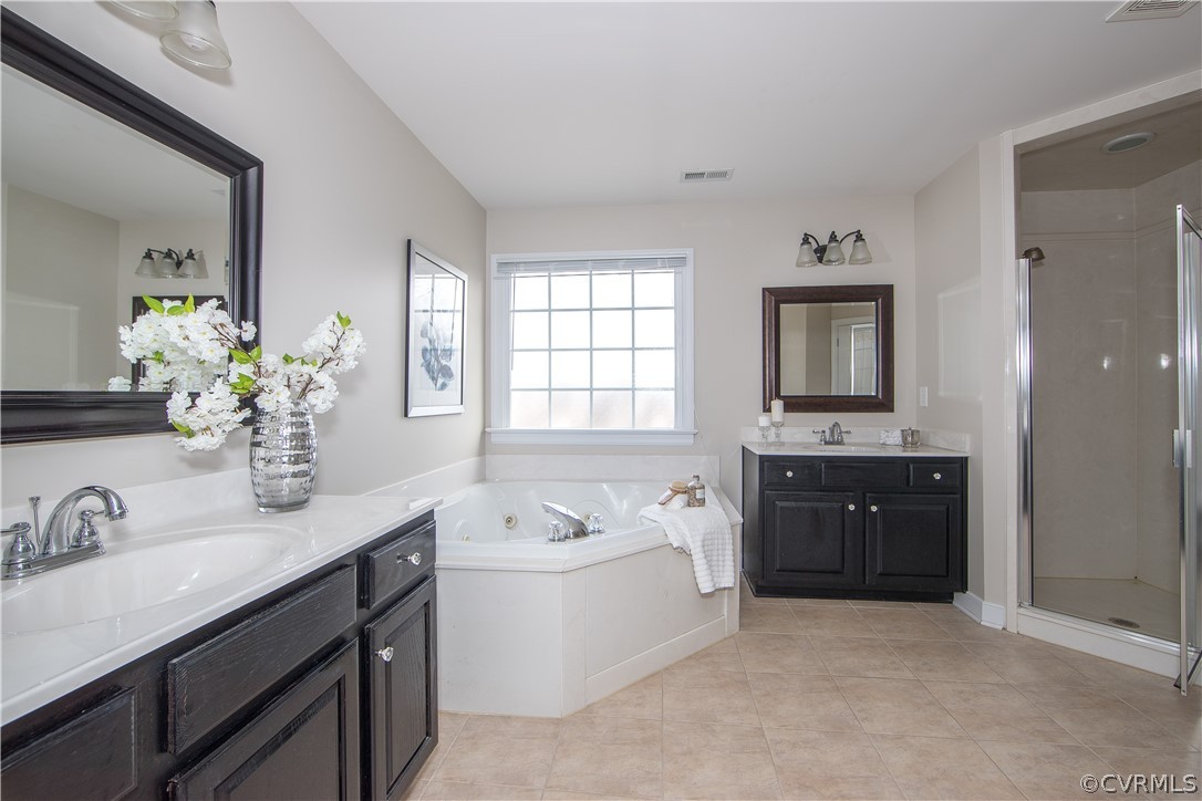1000 Cohen Trail Midlothian, VA 23114 - Photo 29 of 41 a spacious bathroom with a tub sink double vanity granite and mirror