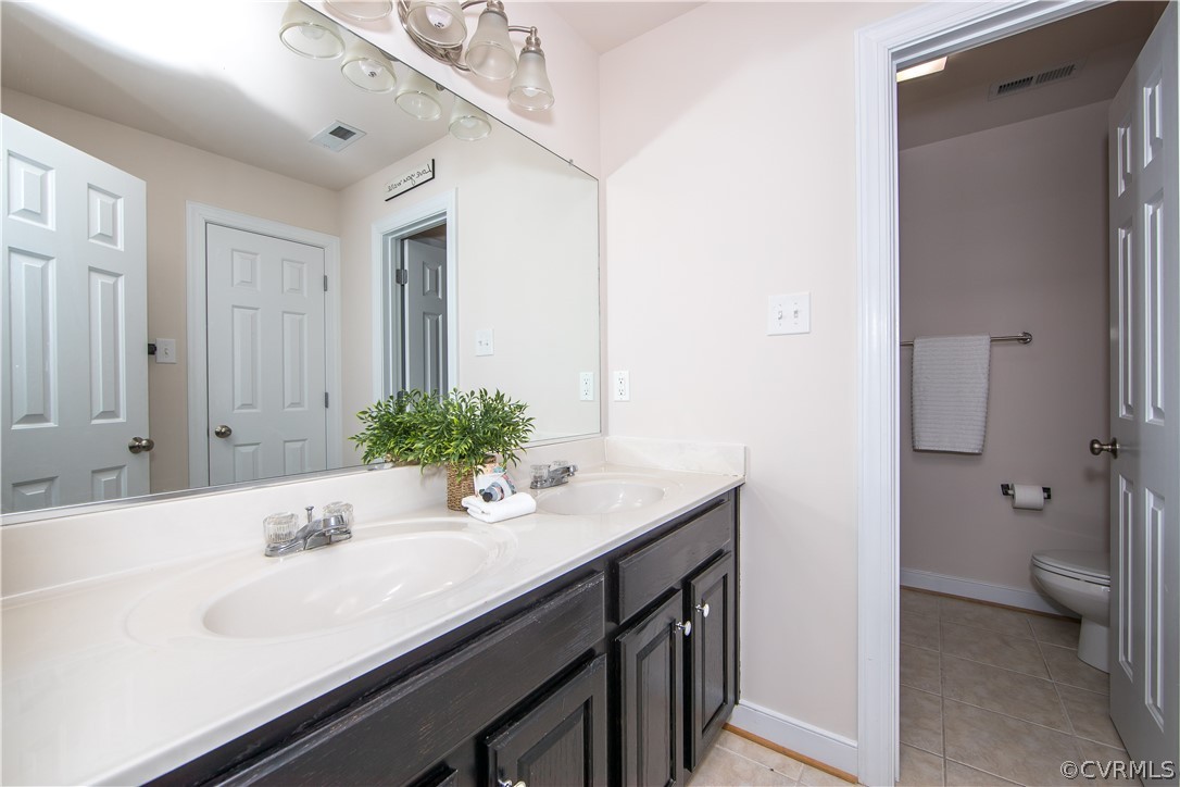 1000 Cohen Trail Midlothian, VA 23114 - Photo 34 of 41 a bathroom with a sink and a mirror
