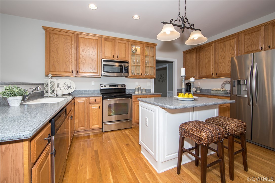 1000 Cohen Trail Midlothian, VA 23114 - Photo 10 of 41 a kitchen with stainless steel appliances granite countertop a sink a stove a refrigerator cabinets and chairs