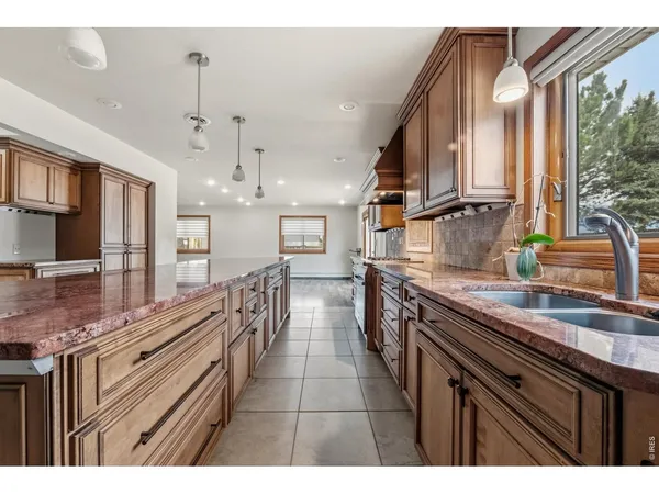 a kitchen with counter top space a sink and cabinets