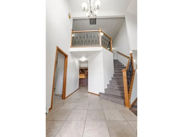 a view of a hallway with seating area