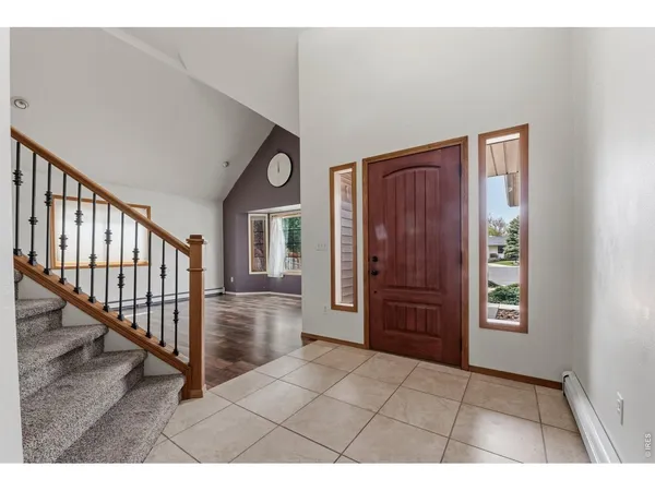 a view interior of a house with wooden floor windows and entryway
