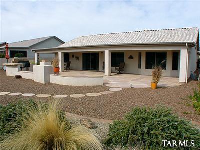 62195 East Northwood Road Tucson, AZ 85739 - Photo 23 of 25 a front view of a house with garden