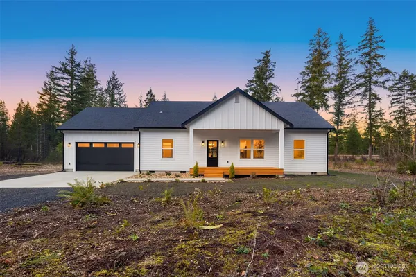 a house with trees in the background