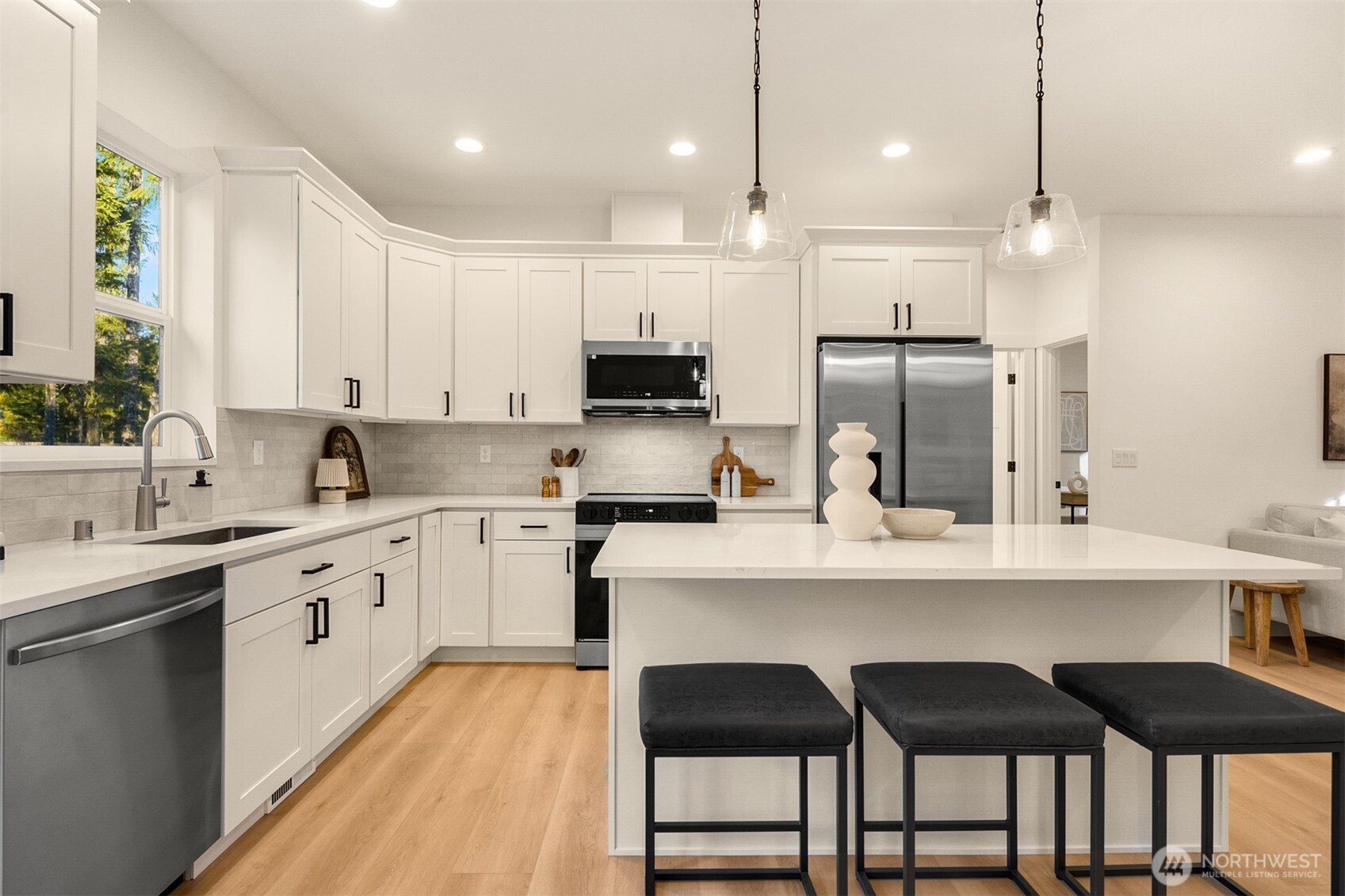 3000 West Martin Road Shelton, WA 98584 - Photo 11 of 38 a large kitchen with cabinets chairs and stainless steel appliances