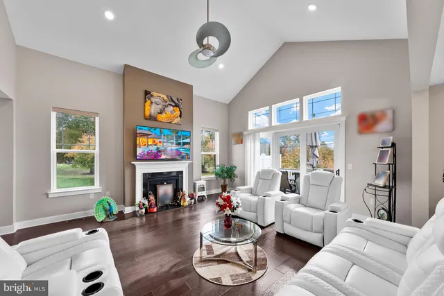 a view of a dining room with furniture and chandelier