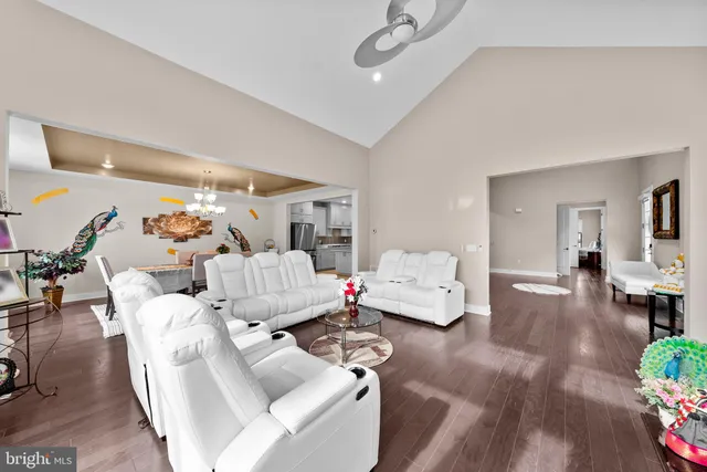 a kitchen with granite countertop cabinets stainless steel appliances and wooden floor