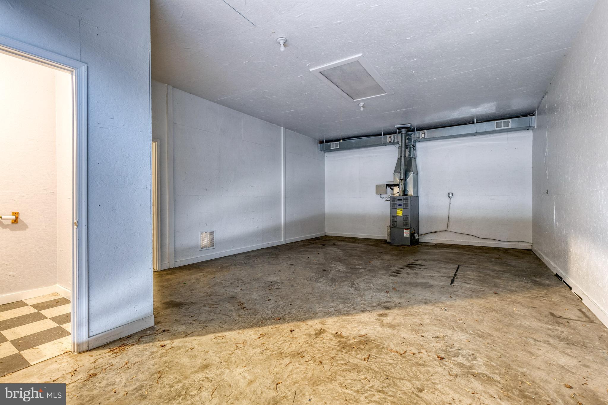 8600 Dogwood Road Baltimore, MD 21244 - Photo 45 of 53 3rd bay inside garage. Furnace sold As-Is