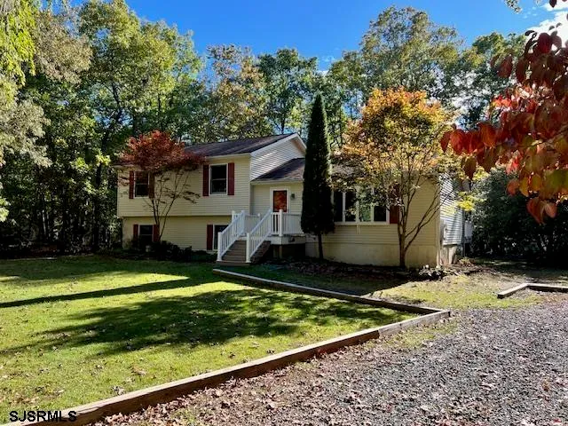 a view of a house with a yard