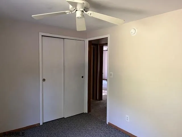 a view of a hallway with a closet