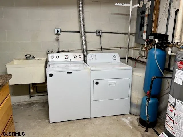 a utility room with dryer and washer