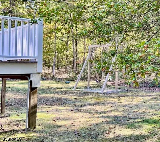a view of a backyard of the house