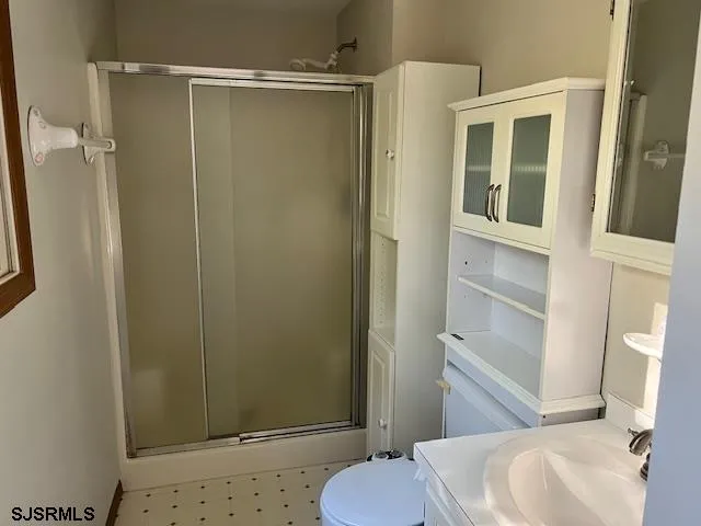 a bathroom with a sink and toilet