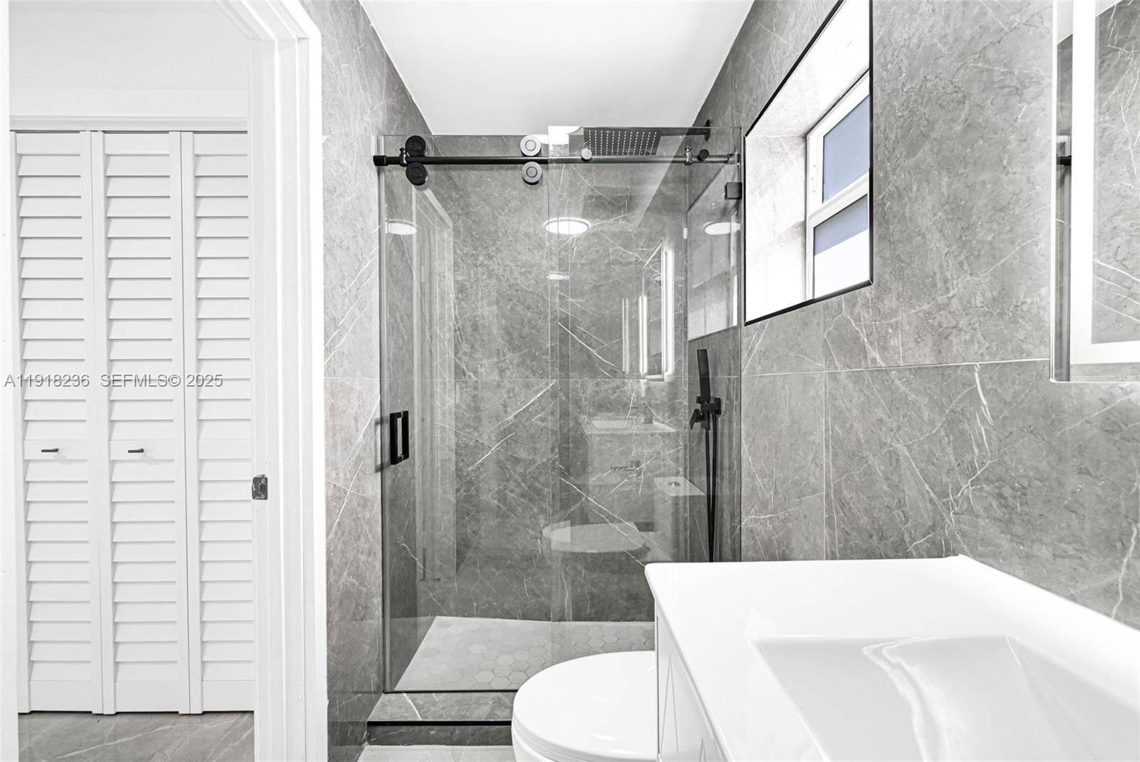 4040 Southwest 108th Avenue Miami, FL 33165 - Photo 11 of 29 a bathroom with a sink toilet and shower