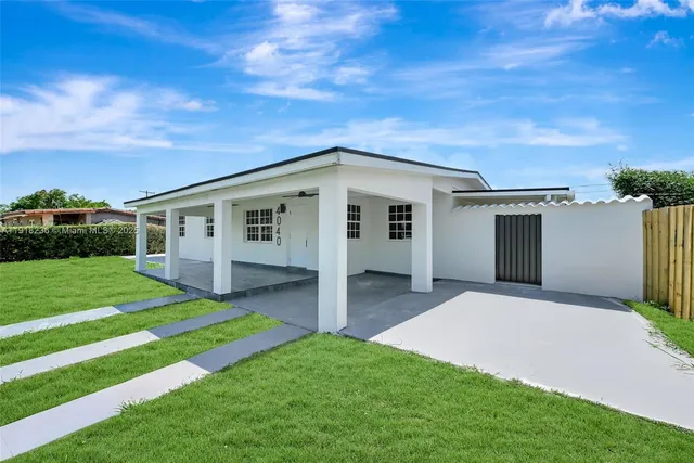 a view of a house with a big yard