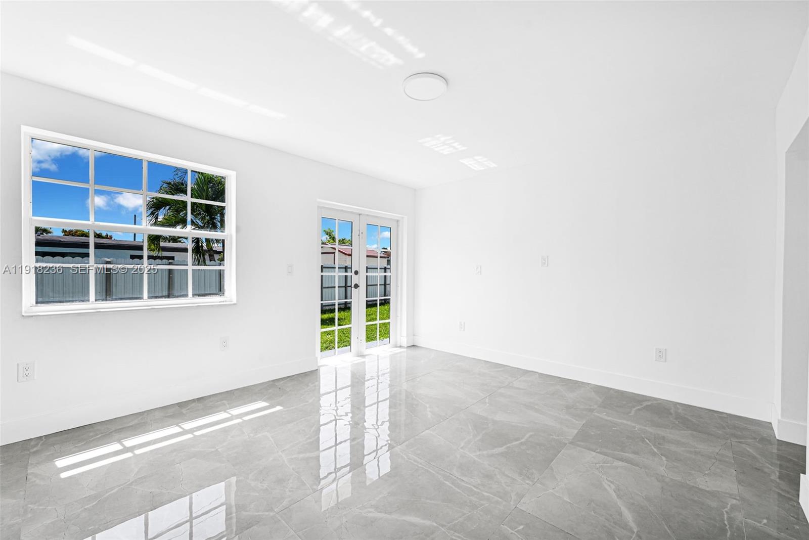 4040 Southwest 108th Avenue Miami, FL 33165 - Photo 26 of 29 a view of an empty room with a window