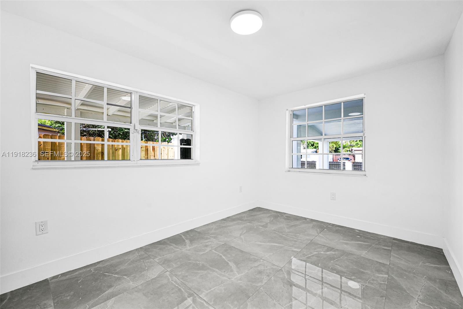 4040 Southwest 108th Avenue Miami, FL 33165 - Photo 28 of 29 an empty room with windows