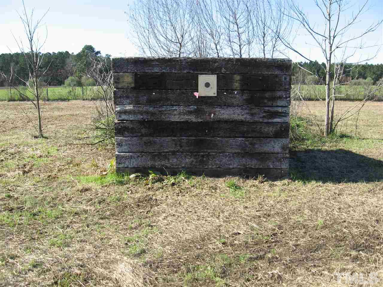 185 Libbie Road Autryville, NC 28318 - Photo 22 of 25 a view of a house with a yard