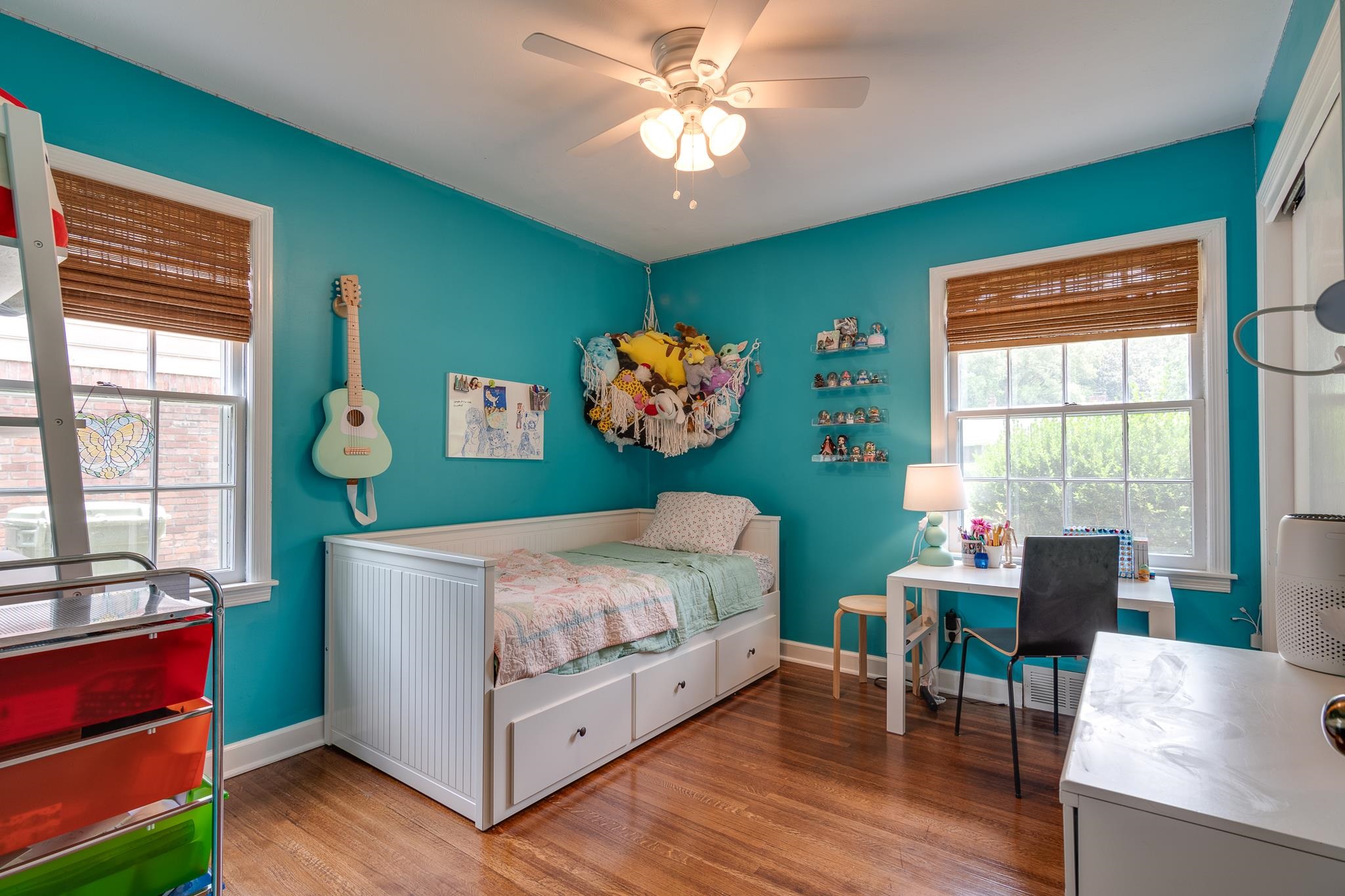 5134 Helene Road Memphis, TN 38117 - Photo 16 of 25 a bedroom with a bed and a chandelier