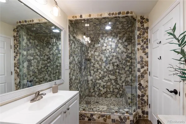 a bedroom with a bed and a table in it