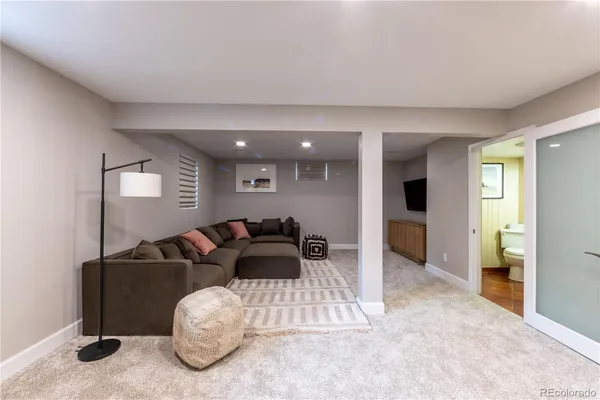 a view of a terrace with furniture and city view