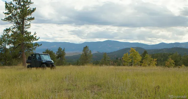 a view of a house with a mountain in the background