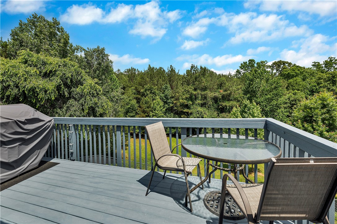131 Morgan Road West Union, SC 29696 - Photo 19 of 39 Enjoy outdoor gatherings on this spacious deck with peaceful views of abundant trees.