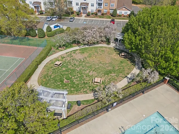 an aerial view of a house with outdoor space