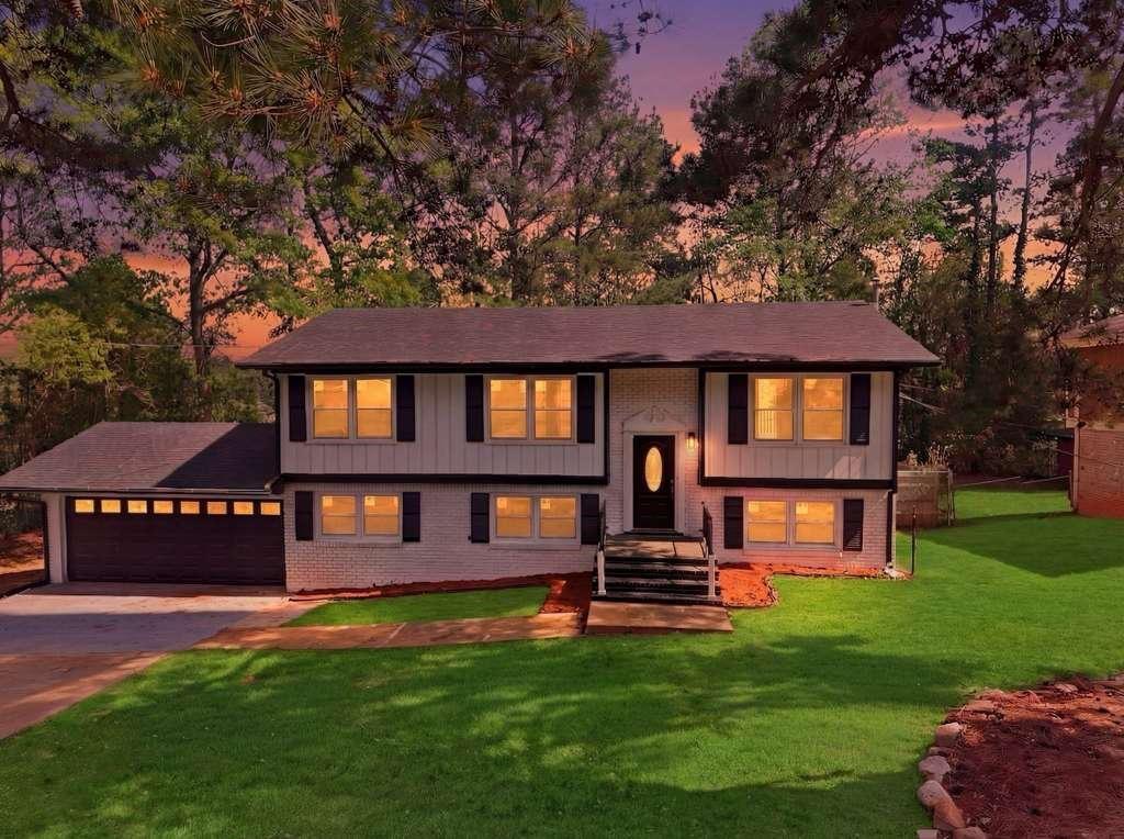 2304 South Hairston Road Decatur, GA 30035 - Photo 1 of 23 a front view of a house with swimming pool and porch