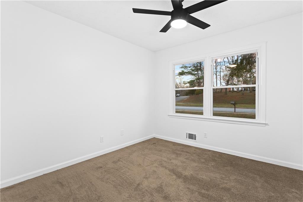 2304 South Hairston Road Decatur, GA 30035 - Photo 14 of 23 an empty room with a window