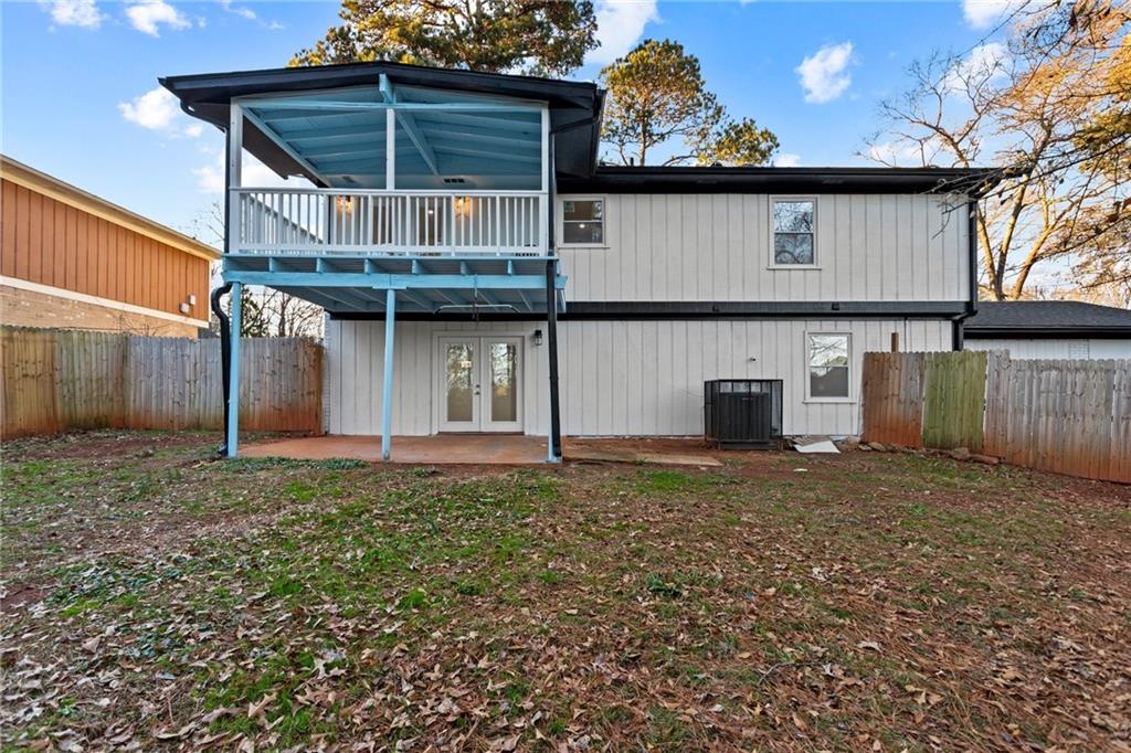 2304 South Hairston Road Decatur, GA 30035 - Photo 20 of 23 a backyard of a house with lots of green space