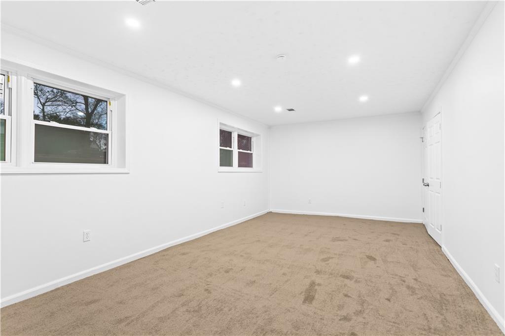 2304 South Hairston Road Decatur, GA 30035 - Photo 8 of 23 an empty room with a workspace