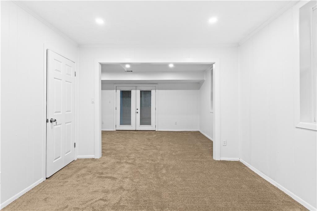 2304 South Hairston Road Decatur, GA 30035 - Photo 9 of 23 an empty room with windows