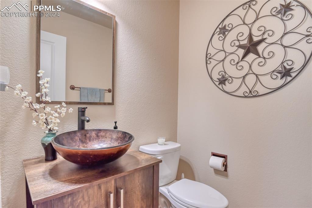 12810 Pommel Circle Elbert, CO 80106 - Photo 13 of 47 a bathroom with a toilet and sink