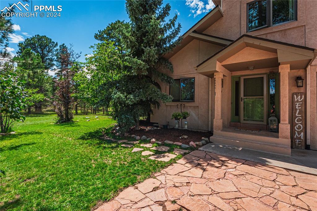 12810 Pommel Circle Elbert, CO 80106 - Photo 3 of 47 a view of a house with a yard