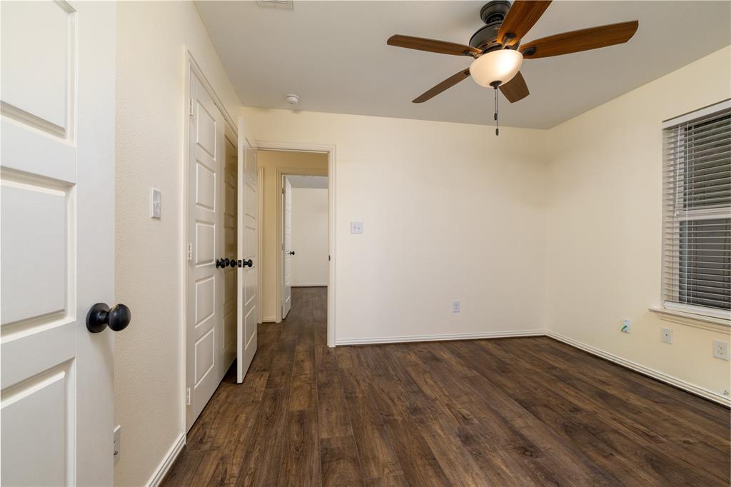 405 Kimbrough Road Azle, TX 76020 - Photo 22 of 39 wooden floor in an empty room with a window