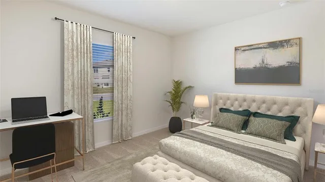 a bedroom with a bed and a desk