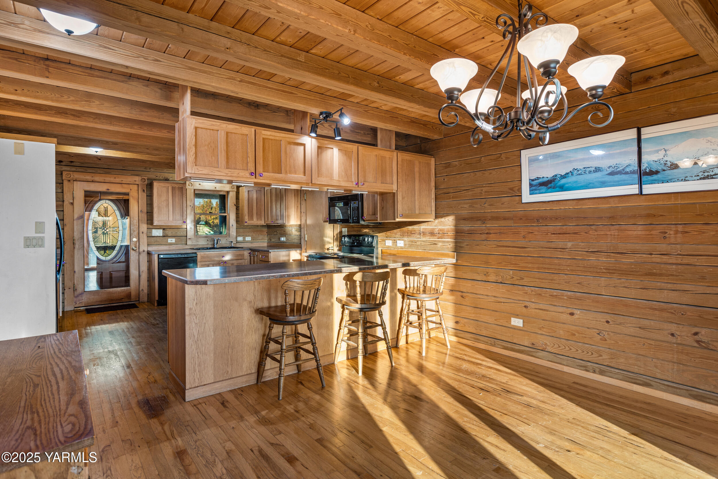 731 Selah Naches Road Selah, WA 98942 - Photo 13 of 44 a kitchen with stainless steel appliances granite countertop a stove a sink and a wooden cabinets