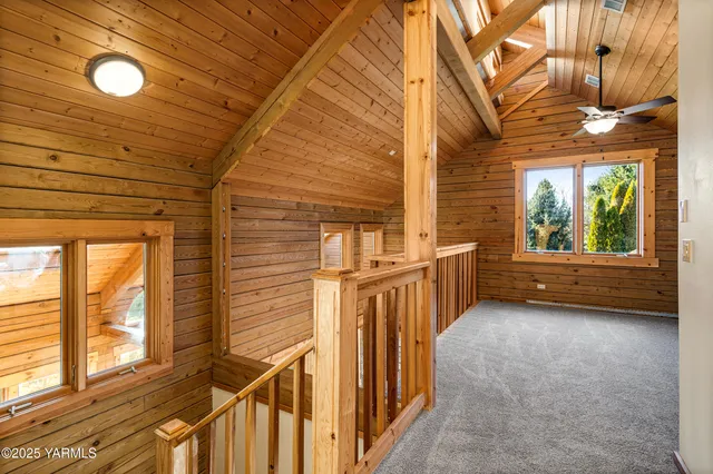 a view of a porch with wooden floor and fence