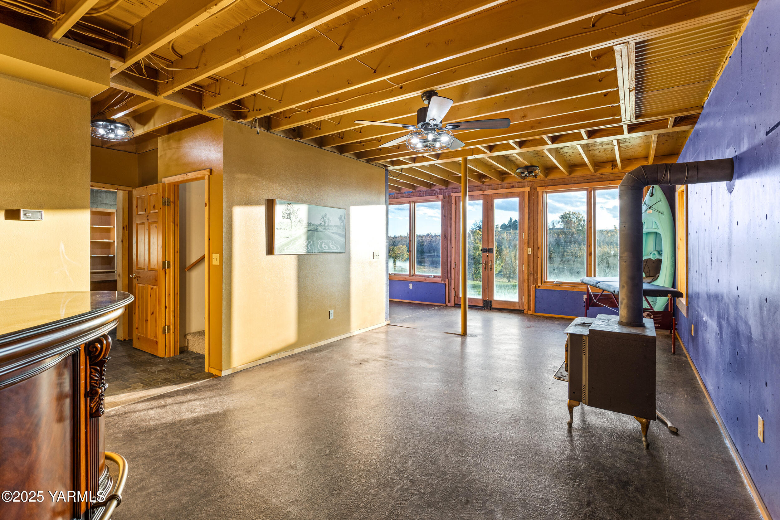 731 Selah Naches Road Selah, WA 98942 - Photo 32 of 44 a view of an empty room with wooden floor and windows