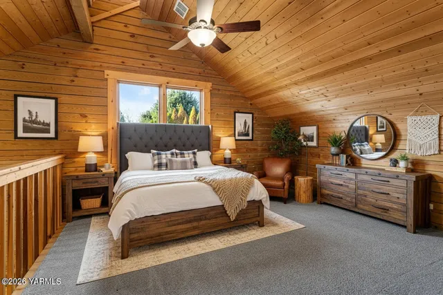 a bed room with a bed and a dresser